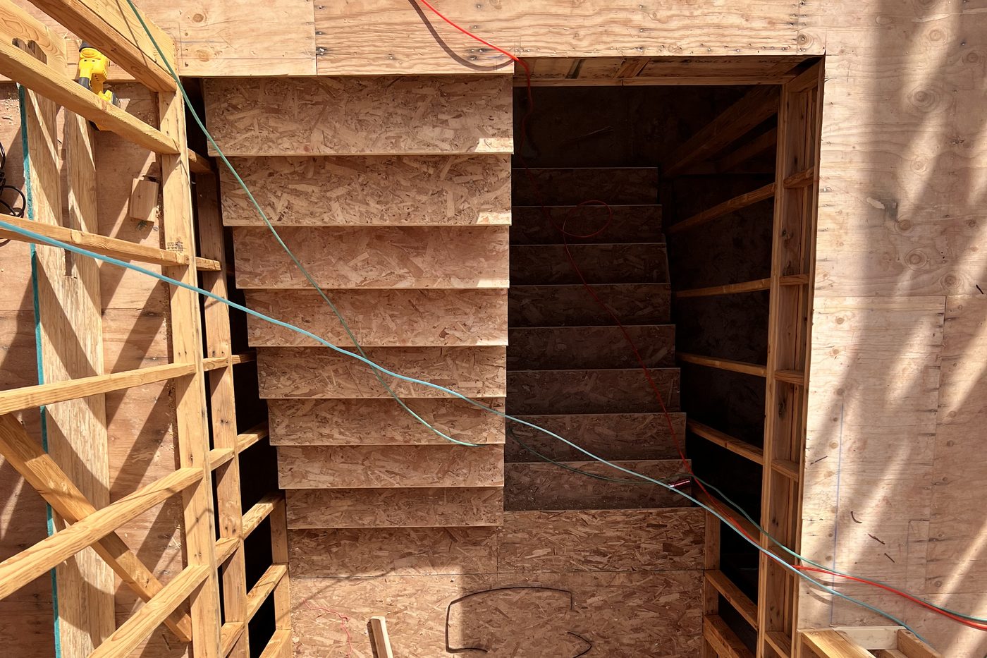 Framed stairwell with stringers and wall studs