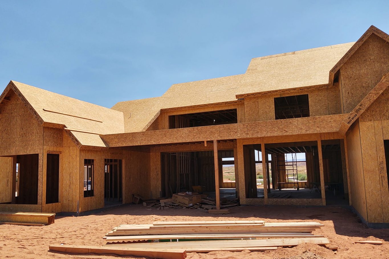 Large two-story home framed and sheathed with a covered porch area